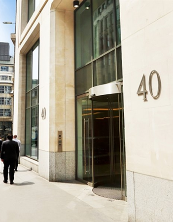 Professional office building entrance with businessman